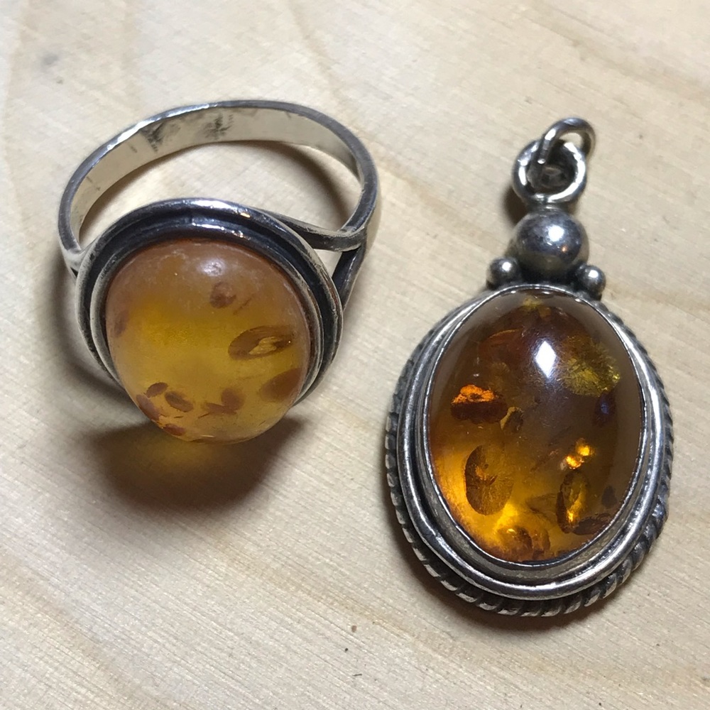 A lot one is the ring and one a pendant. Amber